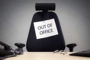 Business chair with "out of office" sign