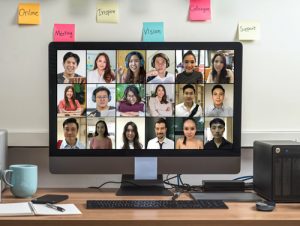 scrren showing group of diverse remote employees onboarding