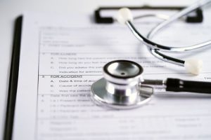 paperwork and stethoscope for employee education  
